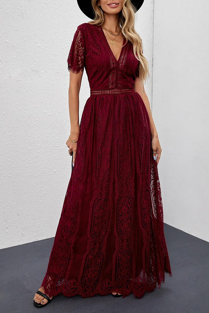 Woman wearing the Scarlett Women's Lace Maxi Dress, a bohemian-inspired dress featuring intricate lace details, a fitted bodice, and flowing skirt, accessorized with a wide-brim hat, creating a chic, free-spirited look.