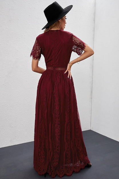 Woman wearing the Scarlett Women's Lace Maxi Dress, a bohemian-inspired dress featuring intricate lace details, a fitted bodice, and flowing skirt, accessorized with a wide-brim hat, creating a chic, free-spirited look.