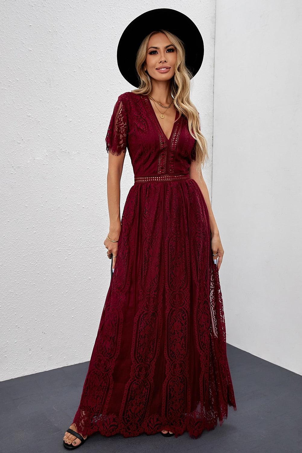 Woman wearing the Scarlett Women's Lace Maxi Dress, a bohemian-inspired dress featuring intricate lace details, a fitted bodice, and flowing skirt, accessorized with a wide-brim hat, creating a chic, free-spirited look.