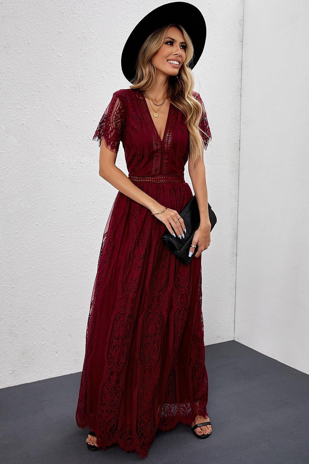 Woman wearing the Scarlett Women's Lace Maxi Dress, a bohemian-inspired dress featuring intricate lace details, a fitted bodice, and flowing skirt, accessorized with a wide-brim hat, creating a chic, free-spirited look.