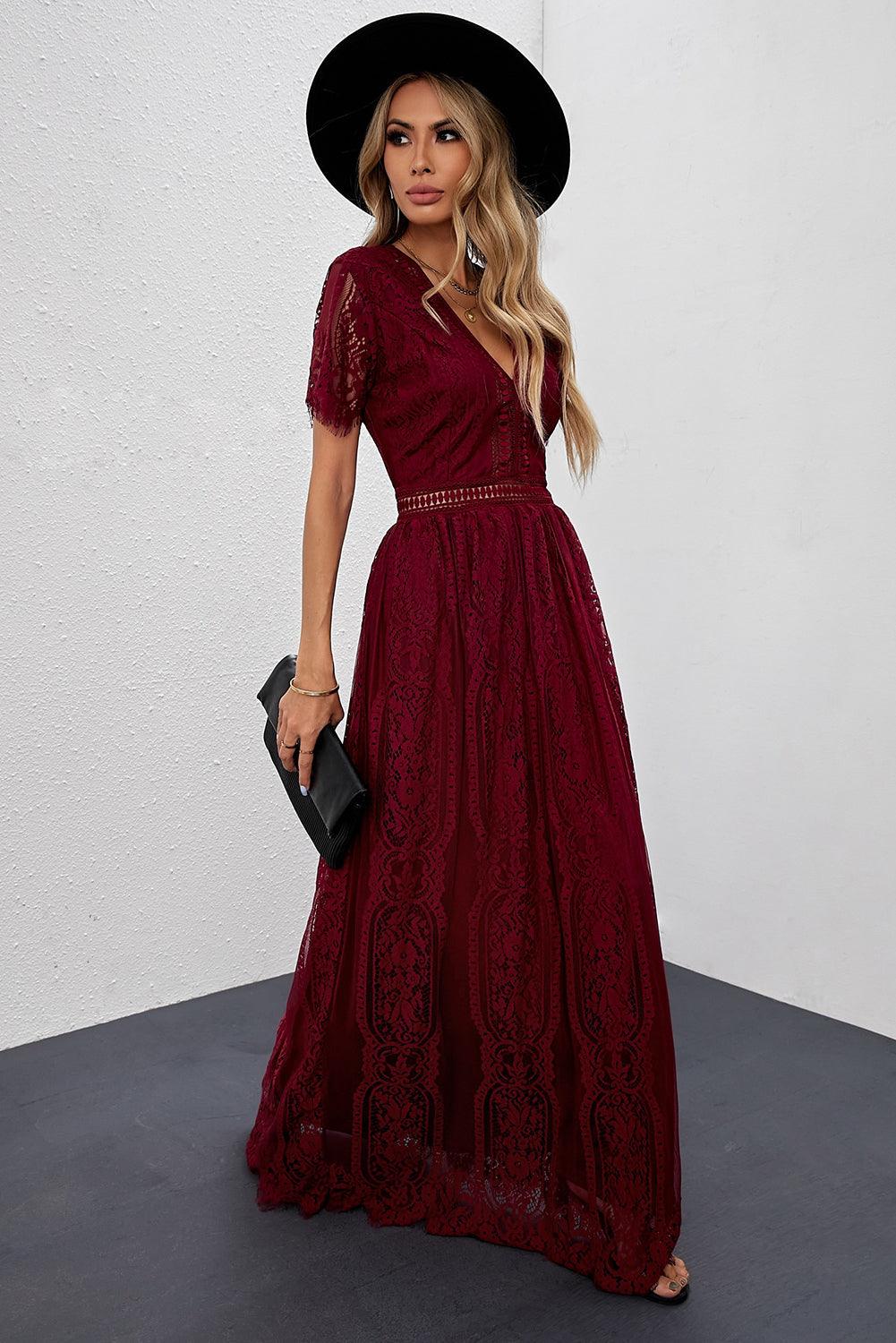 Woman wearing the Scarlett Women's Lace Maxi Dress, a bohemian-inspired dress featuring intricate lace details, a fitted bodice, and flowing skirt, accessorized with a wide-brim hat, creating a chic, free-spirited look.