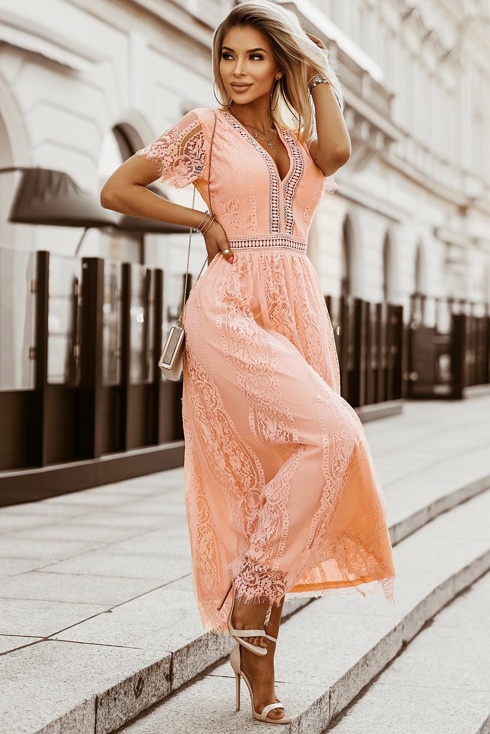 Woman wearing the Scarlett Women's Lace Maxi Dress, a bohemian-inspired dress featuring intricate lace details, a fitted bodice, and flowing skirt, accessorized with a wide-brim hat, creating a chic, free-spirited look.