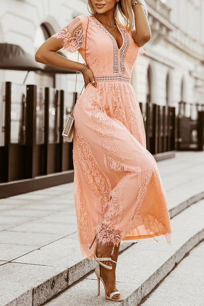 Woman wearing the Scarlett Women's Lace Maxi Dress, a bohemian-inspired dress featuring intricate lace details, a fitted bodice, and flowing skirt, accessorized with a wide-brim hat, creating a chic, free-spirited look.