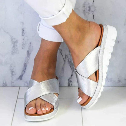 Image showing women's casual sandals with a crisscross strap design, offering a comfortable fit and ideal for casual outings or relaxed wear.