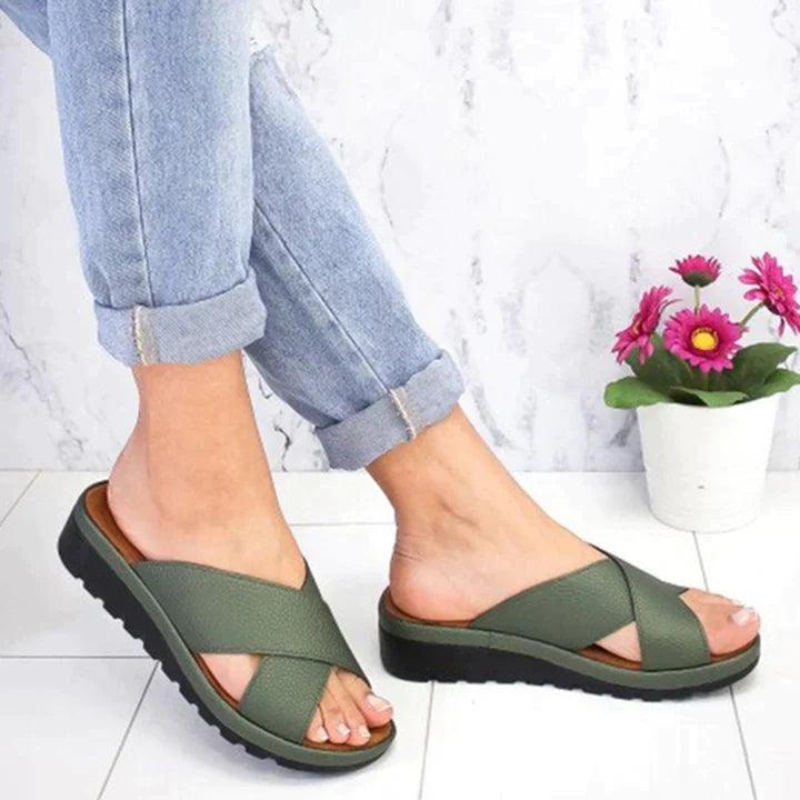 Image showing women's casual sandals with a crisscross strap design, offering a comfortable fit and ideal for casual outings or relaxed wear.
