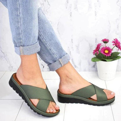 Image showing women's casual sandals with a crisscross strap design, offering a comfortable fit and ideal for casual outings or relaxed wear.