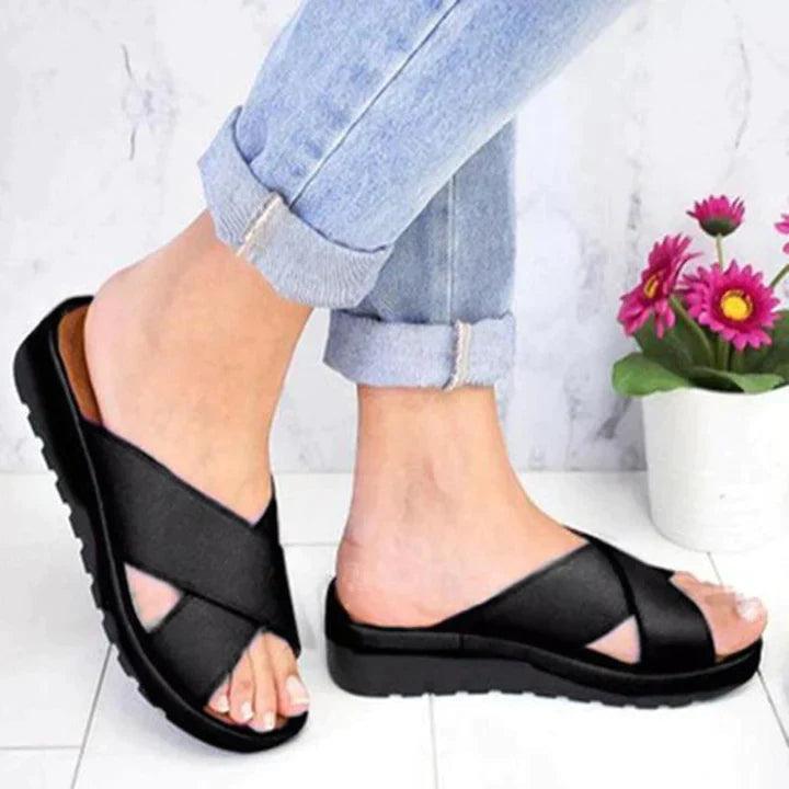 Image showing women's casual sandals with a crisscross strap design, offering a comfortable fit and ideal for casual outings or relaxed wear.