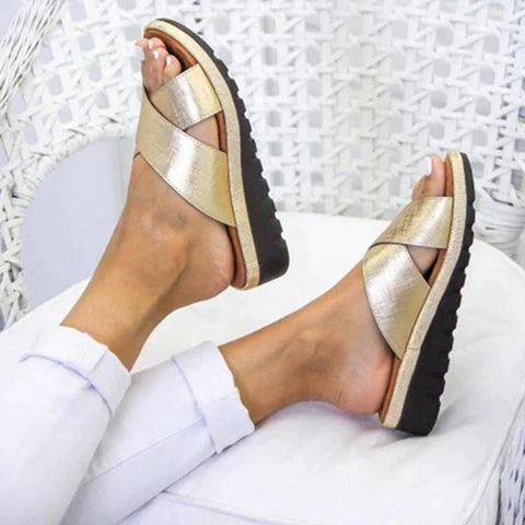 Image showing women's casual sandals with a crisscross strap design, offering a comfortable fit and ideal for casual outings or relaxed wear.