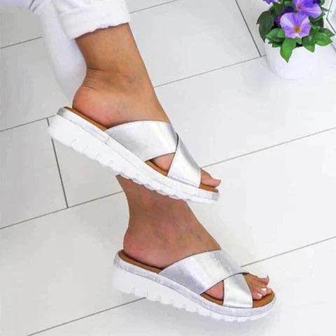 Image showing women's casual sandals with a crisscross strap design, offering a comfortable fit and ideal for casual outings or relaxed wear.