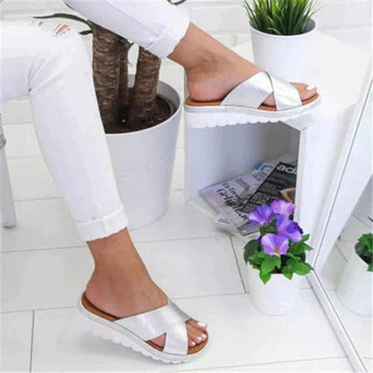 Image showing women's casual sandals with a crisscross strap design, offering a comfortable fit and ideal for casual outings or relaxed wear.