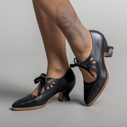 Image showing women's vintage heels with a stylish bow tie design and elegant cut-out details, perfect for adding a chic touch to formal or semi-formal outfits.