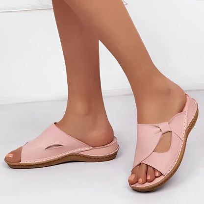 Image showing a pair of women's casual sandals with a cross-strap design, offering a comfortable fit and ideal for casual wear or relaxed outings.