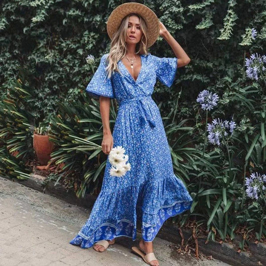 Woman wearing the Sabrina Women's Bohemian Maxi Dress, a flowing ruffled dress with a relaxed, bohemian style, posing gracefully in front of a classic car, exuding a free-spirited and elegant vibe.