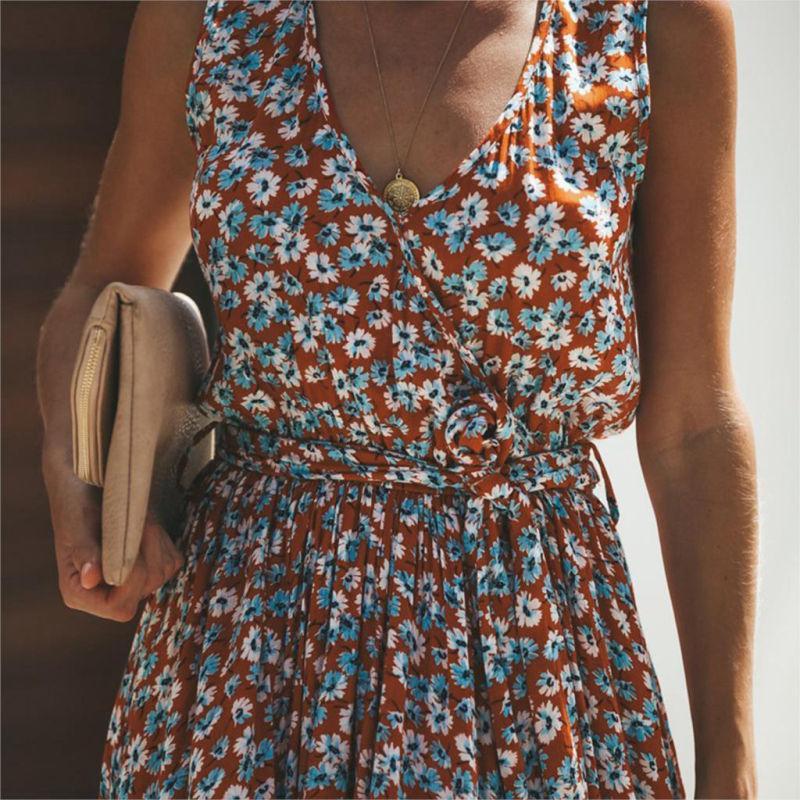 Woman wearing the Emily Women's Flowing Maxi Dress, a long, elegant dress with a flattering fit, accessorized with statement earrings, sunglasses, and a clutch bag, standing outdoors in a stylish, relaxed pose.