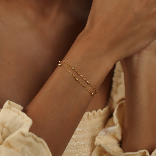 Close-up of a model wearing the Sofia Women's Delicate Bracelet, featuring a minimalist and elegant design, perfect for adding a subtle touch of sophistication to any outfit.