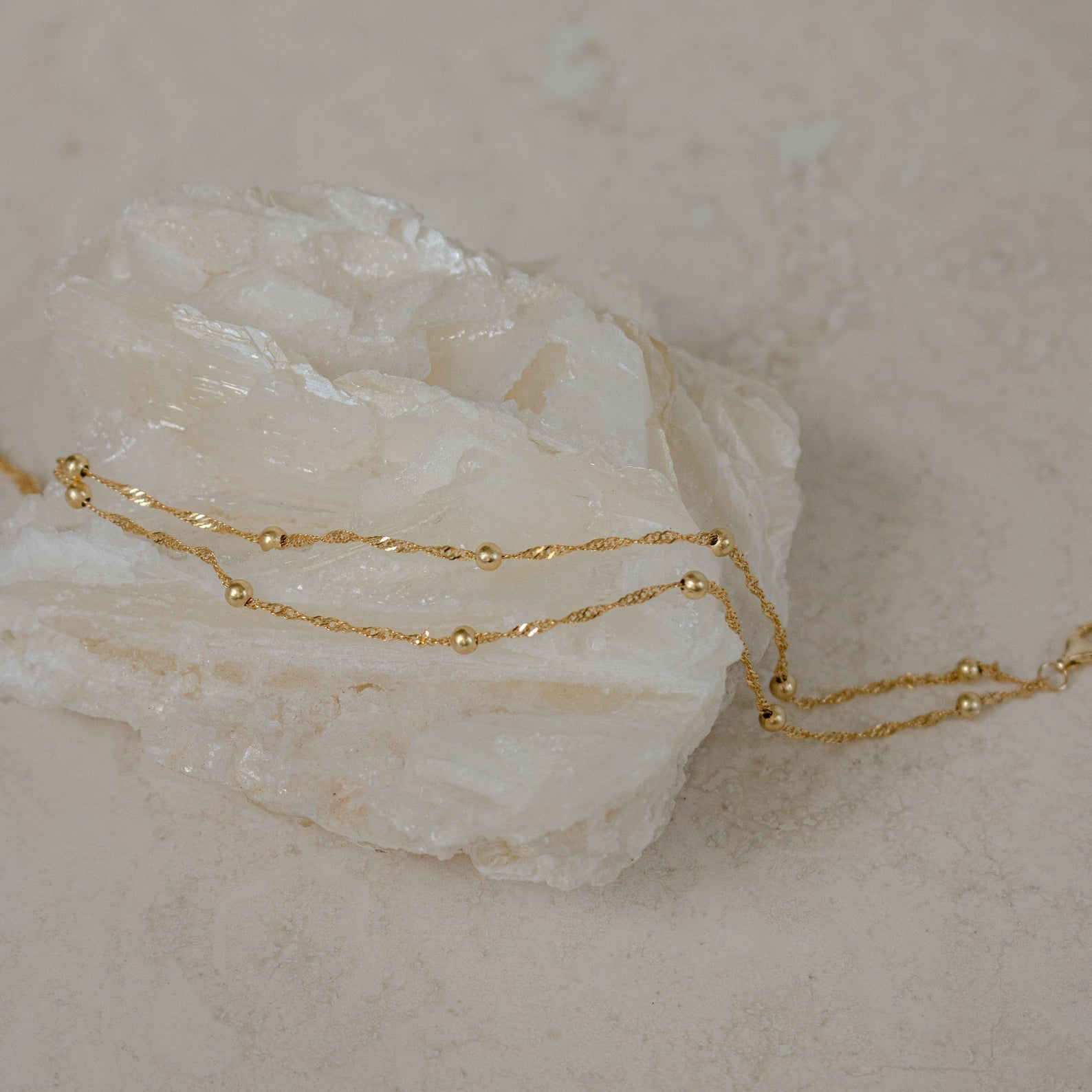 Close-up of a model wearing the Sofia Women's Delicate Bracelet, featuring a minimalist and elegant design, perfect for adding a subtle touch of sophistication to any outfit.