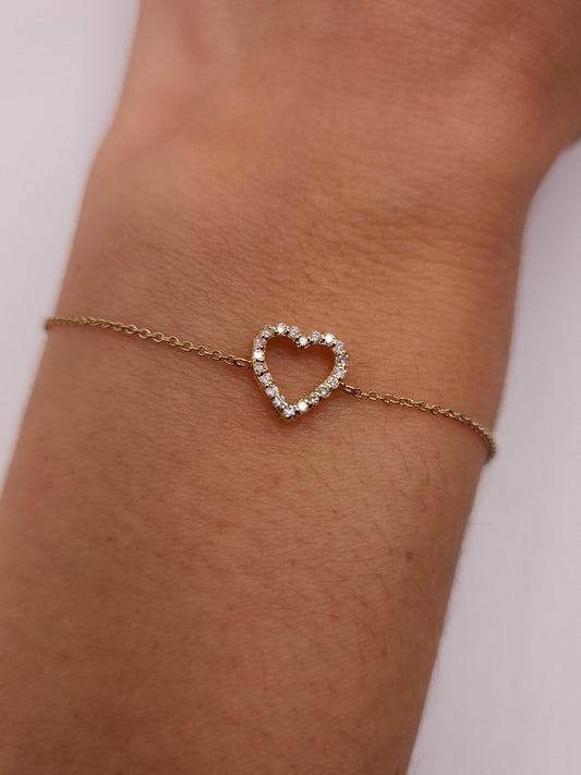 Close-up of the Lily Women's Heart Bracelet featuring a delicate heart-shaped design on the wrist. A charming and elegant accessory perfect for adding a romantic touch to any outfit.