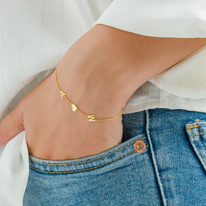 Close-up of a model wearing the Elena Women's Personalized Bracelet featuring a custom name design, paired with a matching personalized necklace for a chic and meaningful look.