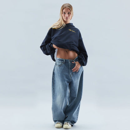 A person wearing the Harper Women's Oversized Hoodie paired with relaxed-fit jeans, showcasing the casual and comfortable style of the hoodie.