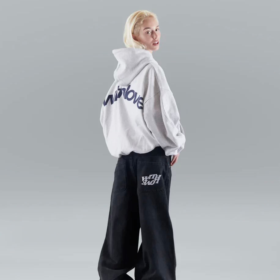A person wearing the Harper Women's Oversized Hoodie paired with relaxed-fit jeans, showcasing the casual and comfortable style of the hoodie.