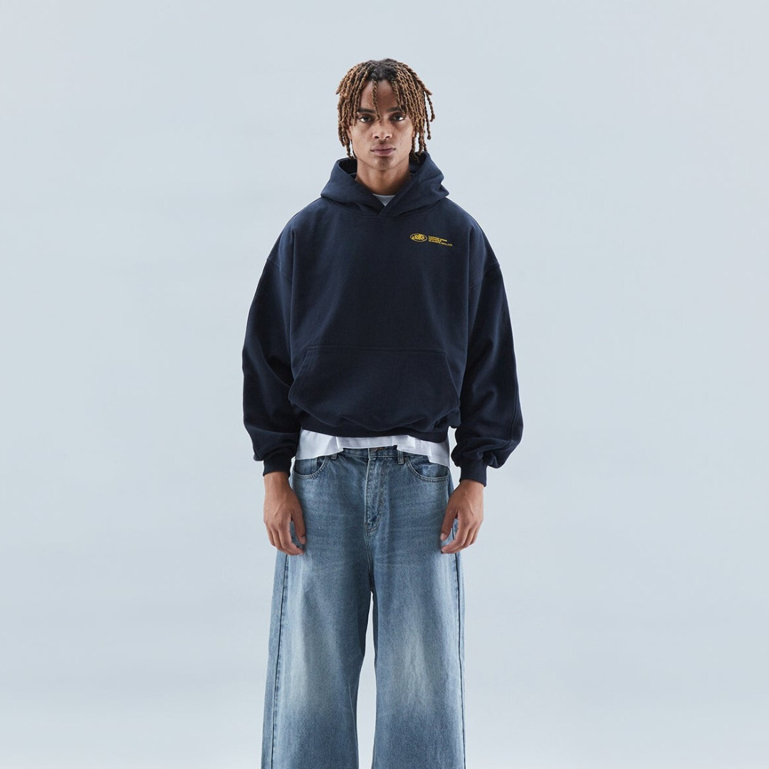 A person wearing the Harper Women's Oversized Hoodie paired with relaxed-fit jeans, showcasing the casual and comfortable style of the hoodie.