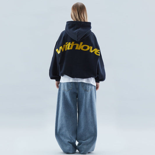 A person wearing the Harper Women's Oversized Hoodie paired with relaxed-fit jeans, showcasing the casual and comfortable style of the hoodie.
