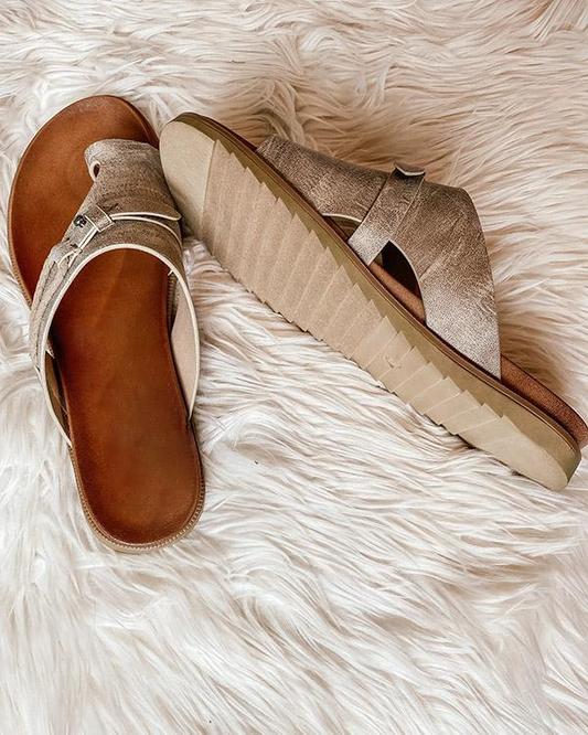 Women's stylish sandals with a comfortable design, perfect for casual outings and everyday wear, shown paired with jeans for a relaxed look.
