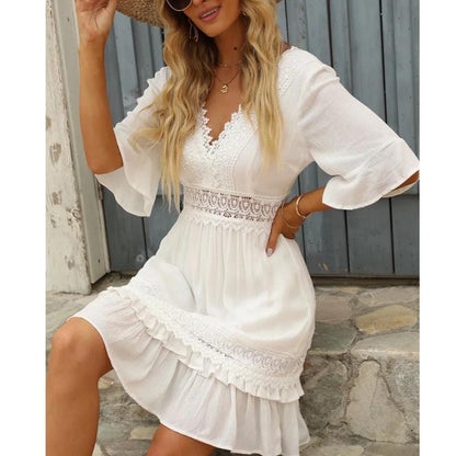 Woman wearing the Grace | Women's Lace Detail Dress | Ruffled Hem Dress, showcasing intricate lace detailing on the bodice and sleeves, with a flattering V-neckline and playful ruffled hem, creating an elegant and feminine look.