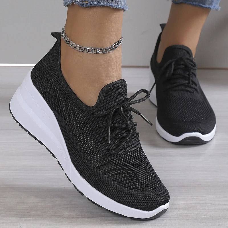 Close-up of a stylish and breathable women's lightweight shoe with a comfortable fit, perfect for casual wear and daily activities.