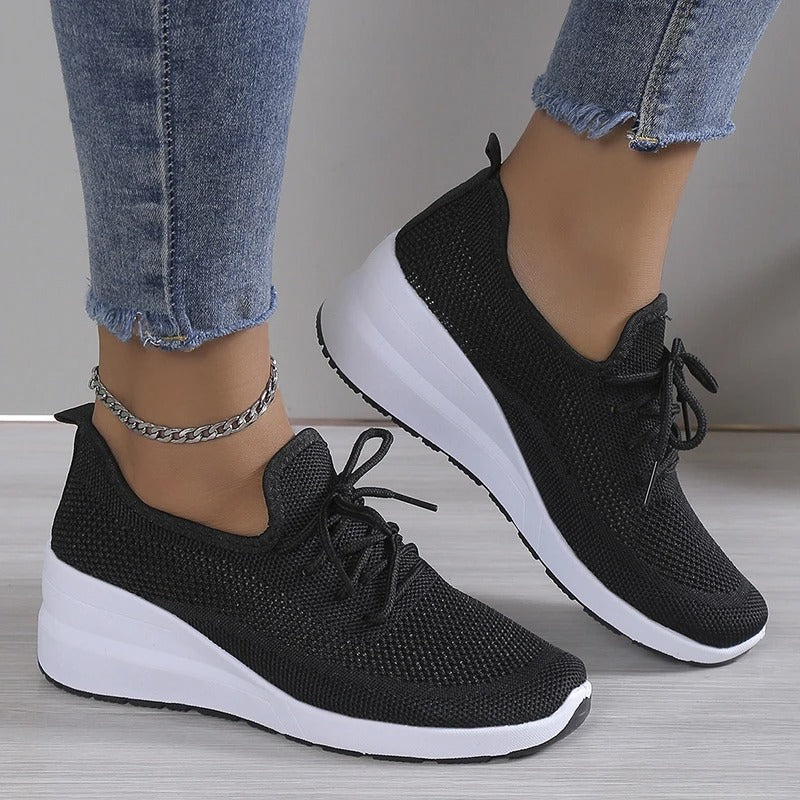Close-up of a stylish and breathable women's lightweight shoe with a comfortable fit, perfect for casual wear and daily activities.