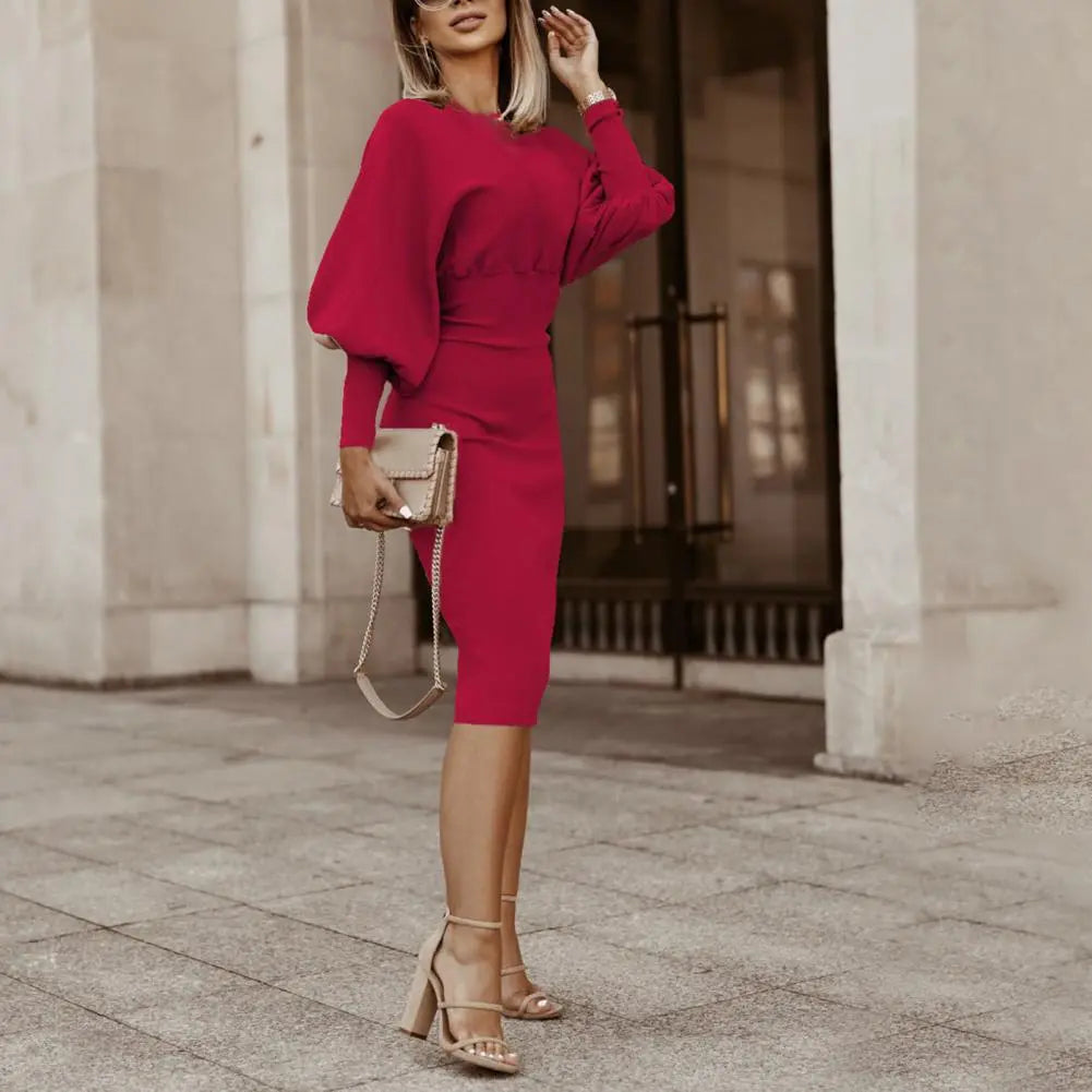 A stylish woman wearing the Sophia | Women's Elegant Midi Dress | Puff Sleeve Dress, showcasing its fitted silhouette, puff sleeves, and refined midi length, ideal for formal or semi-formal occasions.