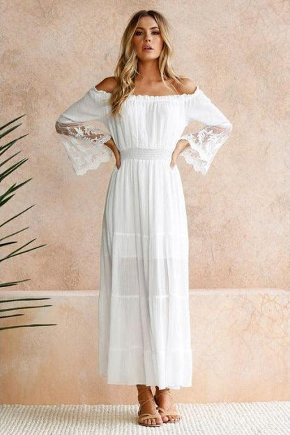 Model wearing the Amelia Women's Off-Shoulder Dress, featuring an elegant off-shoulder design, flowy silhouette, and delicate sleeve detailing, perfect for formal or casual occasions.