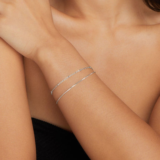 Close-up of the Lily Women's Charm Bracelet showcasing delicate charms and an elegant design, perfect for adding a personalized touch to any outfit. A versatile accessory for various occasions.
