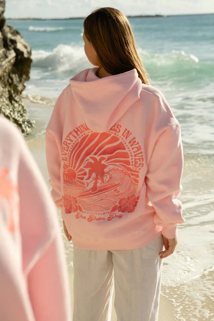 Back view of a woman wearing the Luna Women's Graphic Hoodie, showcasing a detailed graphic design with a relaxed fit, perfect for casual and cozy wear.