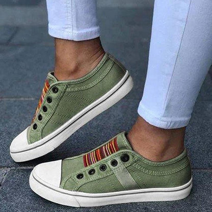 Image showing women's casual sneakers with stylish striped detailing and a classic design, perfect for everyday wear and casual outings.