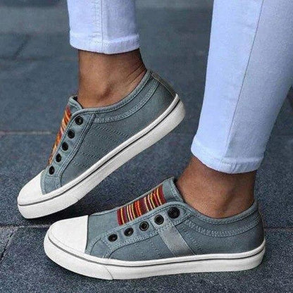 Image showing women's casual sneakers with stylish striped detailing and a classic design, perfect for everyday wear and casual outings.