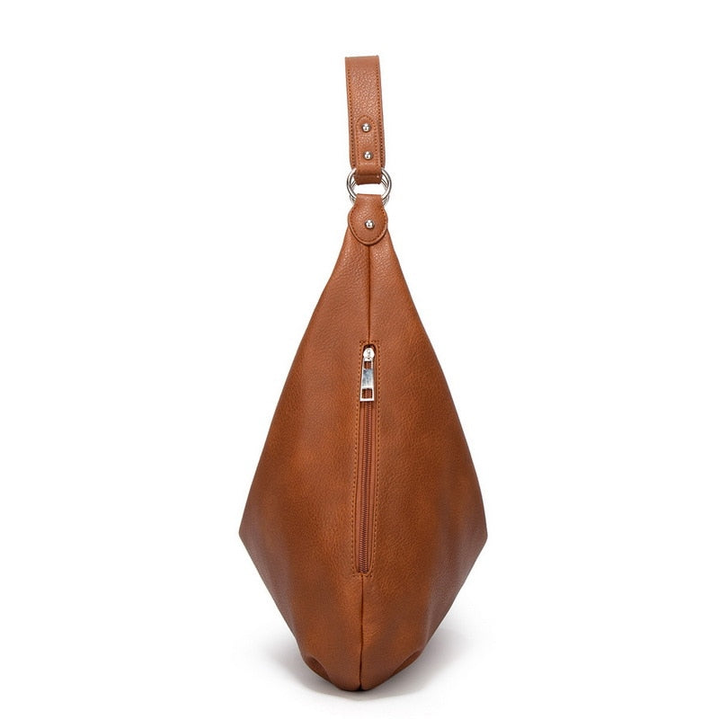 A soft and spacious Sabrina Women's Hobo Bag with a casual, slouchy design and a single shoulder strap. This versatile shoulder bag offers ample space for essentials, making it an ideal accessory for everyday use or casual outings.