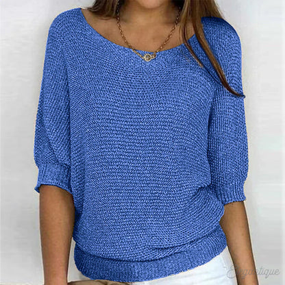 Image of a woman wearing an elegant relaxed fit sweater, featuring a chic design perfect for casual and stylish occasions.