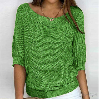 Image of a woman wearing an elegant relaxed fit sweater, featuring a chic design perfect for casual and stylish occasions.