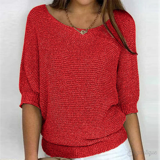 Image of a woman wearing an elegant relaxed fit sweater, featuring a chic design perfect for casual and stylish occasions.