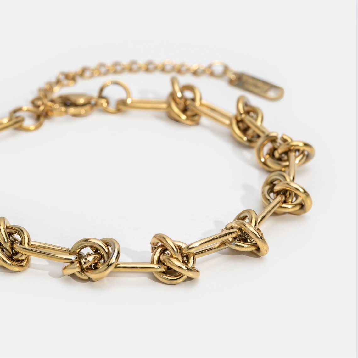 Close-up of the Sophia Women's Knot Bracelet showcasing its bold design with intricate knot details, perfect for making a statement and enhancing any outfit with a touch of sophistication.