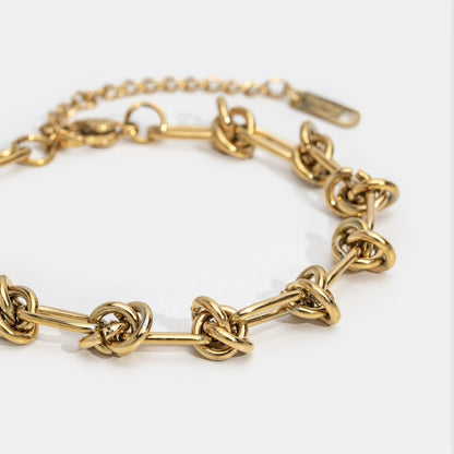Close-up of the Sophia Women's Knot Bracelet showcasing its bold design with intricate knot details, perfect for making a statement and enhancing any outfit with a touch of sophistication.