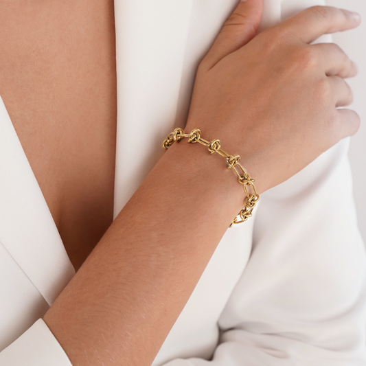 Close-up of the Sophia Women's Knot Bracelet showcasing its bold design with intricate knot details, perfect for making a statement and enhancing any outfit with a touch of sophistication.